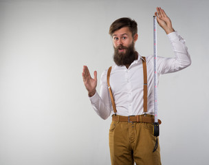 A man  holding a tape measure centimeter