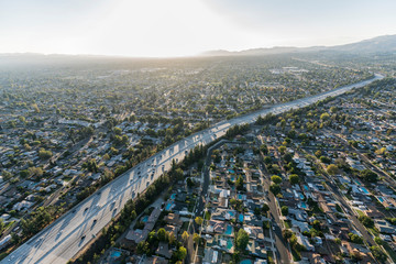 Late afternoon aerial view above the Route 118 freeway in the San Fernando Valley area of Los Angeles, California. - obrazy, fototapety, plakaty