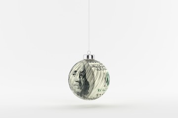 Dollar bill on a glossy christmas ball hanging on a string on white background