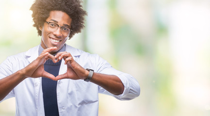 Afro american doctor scientist man over isolated background smiling in love showing heart symbol...