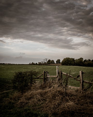The old fence under the clouds