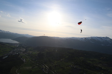 Fototapeta na wymiar Wingsuit skydiving over Norway