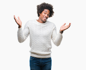 Afro american man over isolated background clueless and confused expression with arms and hands...