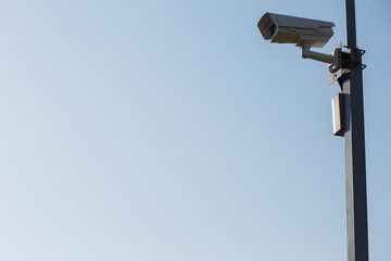 Security camera on blue sky background. Security view post
