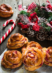 Traditional Swedish Christmas saffron buns lussebulle or lussekatt. Swedish christmas. New Year pastry. Christmas decoration. candy cane. Christmas wreath