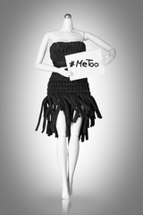 Me too movement concept. Female Mannequin holds a sign with hashtag me too against harassment