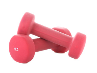 Dumbbells for fitness pink color on a white isolated background. Sport equipment