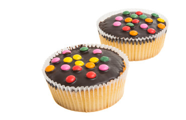 muffin with chocolate colored drops isolated