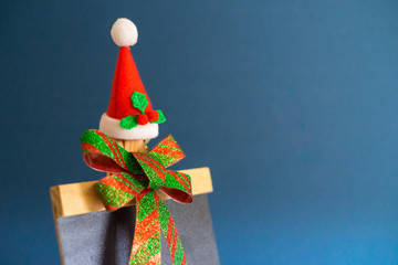 Christmas concept background.Christmas ribbon decoration with santa hat and copy space.