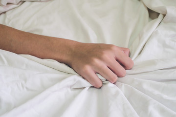 Hands of couple lover sex on the bed,Concept about love, sex and lifestyle.