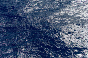 Ocean wave. Dark blue. The view from the top. Close up.