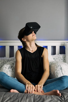 Teenager: Girl Using VR Headset In Bedroom