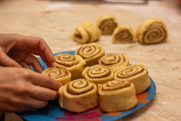 placing raw dough on a dish