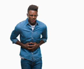 Young african american man over isolated background with hand on stomach because indigestion, painful illness feeling unwell. Ache concept.