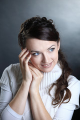 closeup.beautiful young woman in white sweater posing in front of the camera.