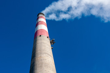 Industrial chimney with smoke.