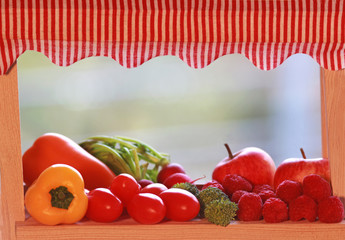 miniature market stall with fruits and vegetables, close-up