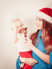 Christmas woman with cute baby.
