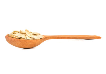 Pumpkin seeds in a spoon