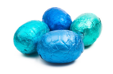 chocolate eggs in color foil isolated