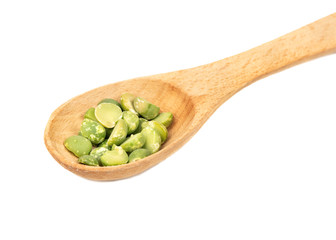 Dry green peas in spoon