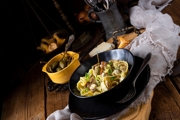 Reginette noodles in cream sauce with fresh chanterelles and capers