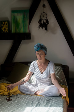 Woman doing kundalini yoga and chanting some mantra