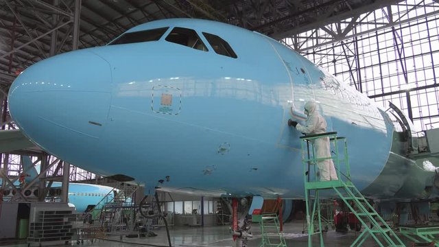 Repair of the aircraft fuselage. The color of the fuselage of the aircraft alyet. The plane goes to the hangar for repairs. The broken wing of the plane. The plane after the accident on the repair. 4k