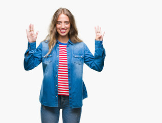 Beautiful young blonde woman over isolated background showing and pointing up with fingers number...