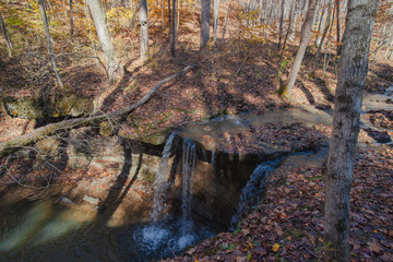 Waterfall in the fall forest 