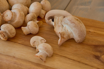 Champignon mushrooms on a cutting board