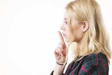 Woman showing silence gesture