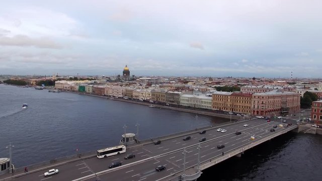 Wedding palace historical building in Saint-Petersburg at English embankment. Aerial drone cityscape view at street and river Neva at the evening in summer.
