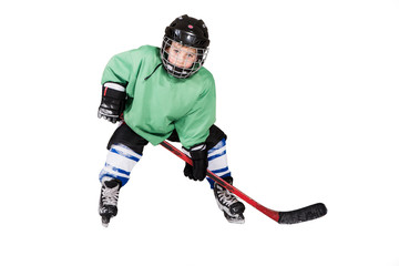 Boy playing ice hockey. Little hockey player isolated on white background.