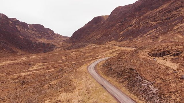 Aerial drone shot of road leading to Bealach na Ba mountain pass in Highlands of Scotland
