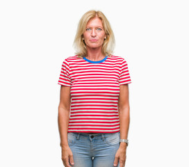 Obraz premium Middle age blonde woman over isolated background with serious expression on face. Simple and natural looking at the camera.