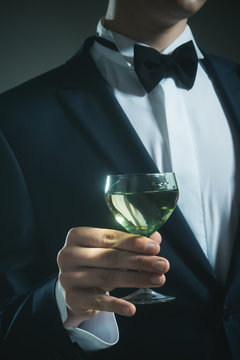 successful business meeting. Deal. wedding. Bride groom on husband with glass. man drink wine. formal male fashion. chears. To us. try this. somelier. party.