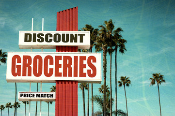 aged and worn discount groceries sign