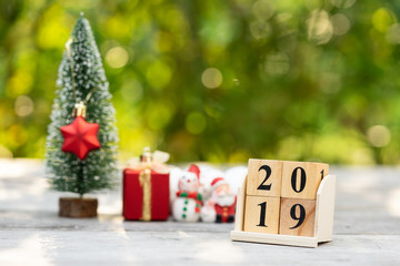 Wood block 2019 and christmas decoration stuffs using as background new year concept