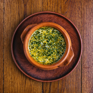 Mushroom soup in a pot. The dish is cooked in the restaurant