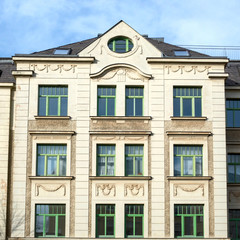 Fototapeta na wymiar renovated vintage house main facade with decorated windows pattern, Gera city in Thuringen, Germany