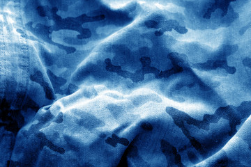 Old camouflage cloth with blur effect in navy blue tone.