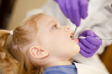 Little Girl at Dentist Getting Teeth Cleaned