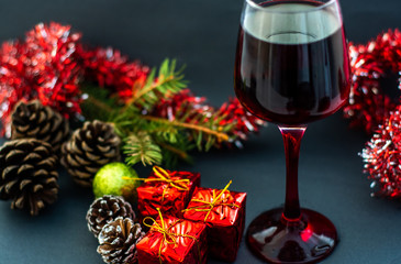 Christams Holiday Red Wine on Wood Table and Christmas Tree
