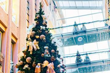 Beautifully decorated Christmas tree in multilevel shopping mall