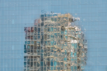 Reflection of one building in another