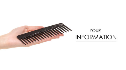Fototapeta na wymiar Black hair comb in hand on white background isolation