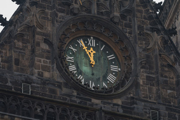 Tower clock five minutes to twelve