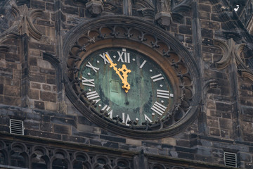 Tower clock five minutes to twelve