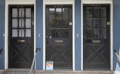 Three wood & glass doors in North Beach district of San Francisco, California